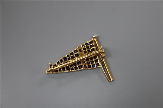 A 20th century yellow metal, sapphire, diamond and enamel set pennant brooch, 27mm, gross 4.4 grams.